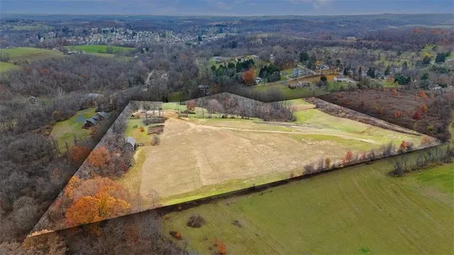 a view of a swimming pool with a yard
