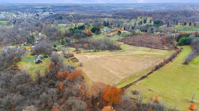 a view of a swimming pool and mountains in the background