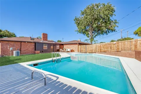 a view of a house with a swimming pool