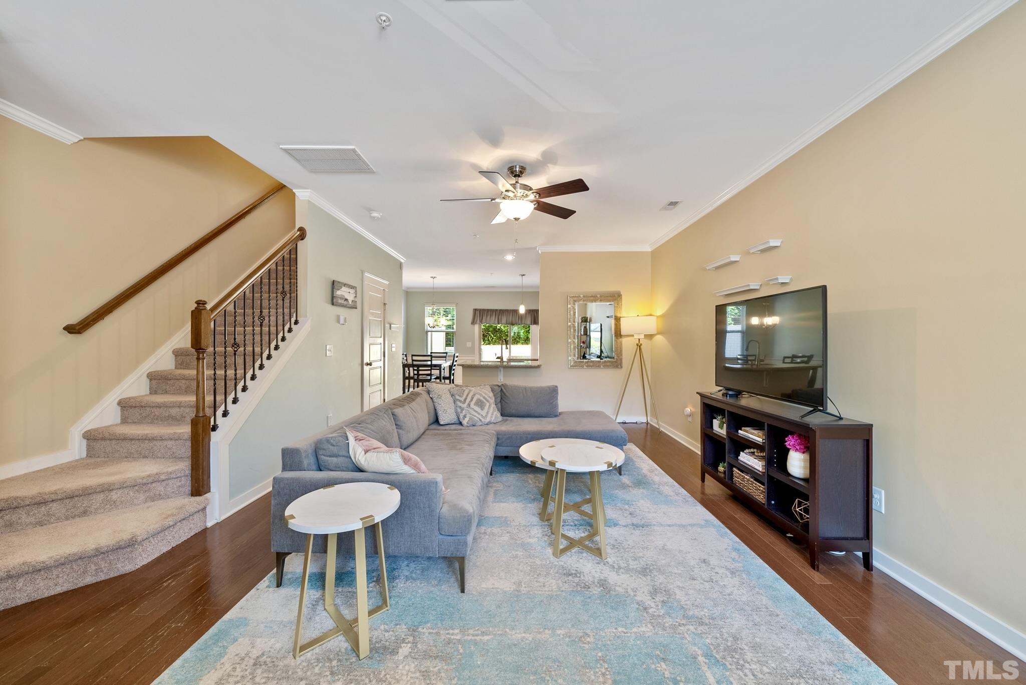 7891 Allscott Way Raleigh, NC 27612 - Photo 3 of 27 a living room with furniture and a flat screen tv