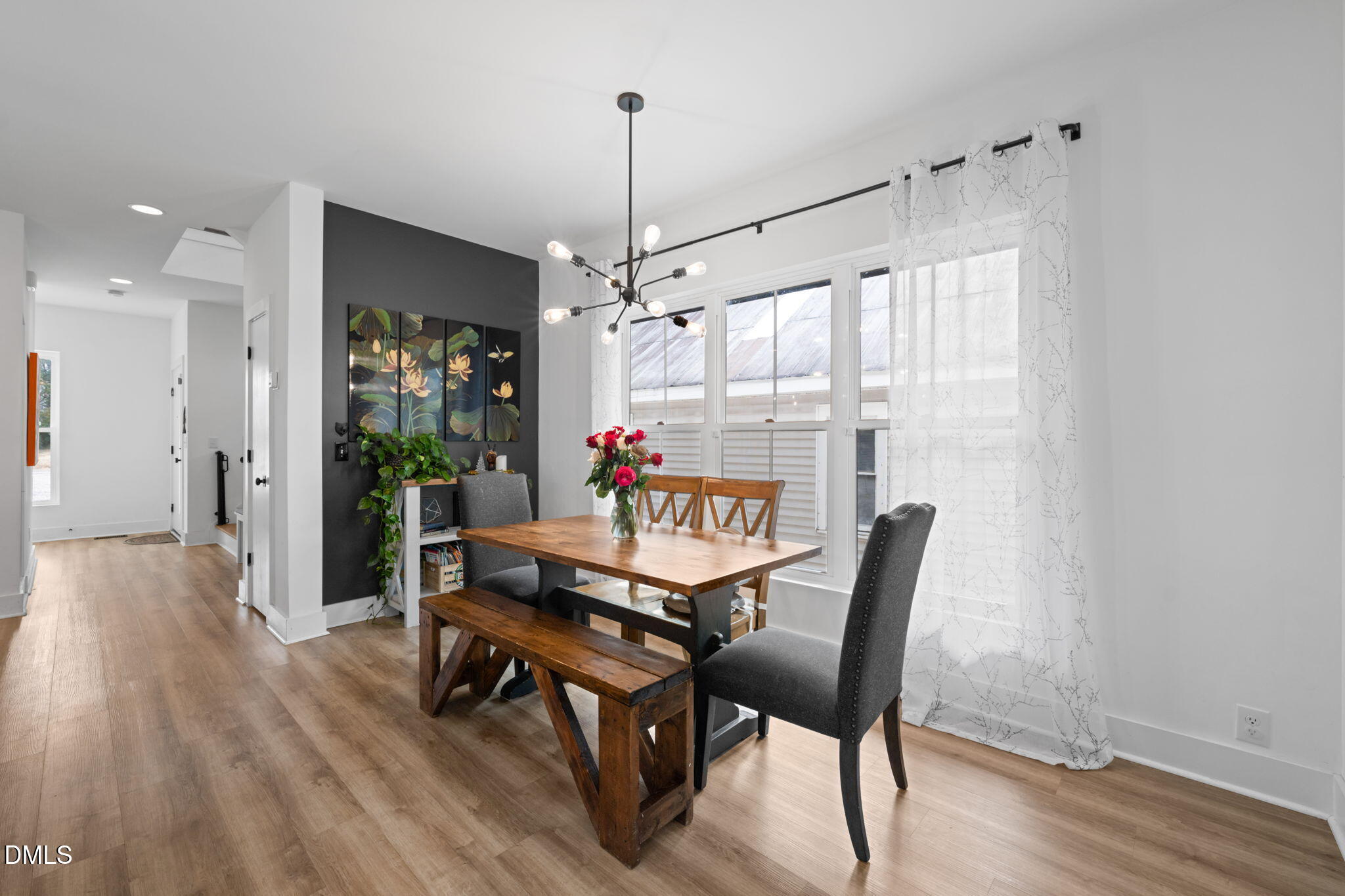 320 South Tarboro Street Raleigh, NC 27610 - Photo 15 of 54 a dining room with furniture window wooden floor