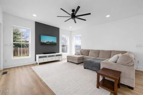 a bedroom with a bed and a chair
