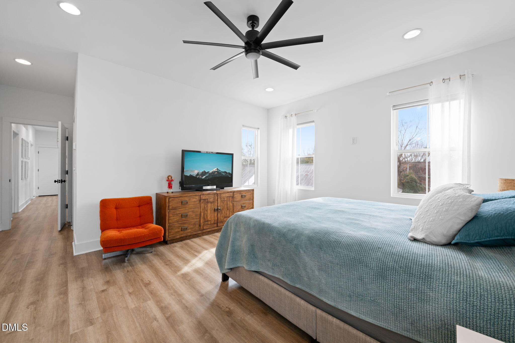 320 South Tarboro Street Raleigh, NC 27610 - Photo 19 of 54 a bedroom with a bed and a couch