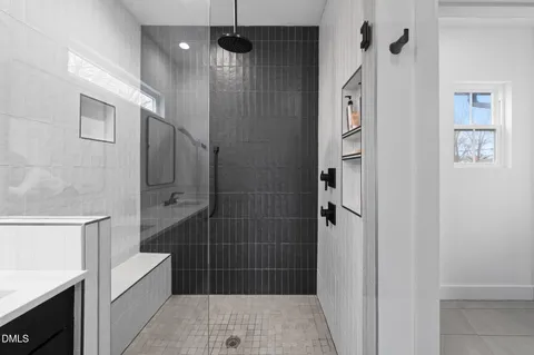 a bathroom with a double vanity sink and mirror