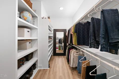a kitchen with a refrigerator and cabinets