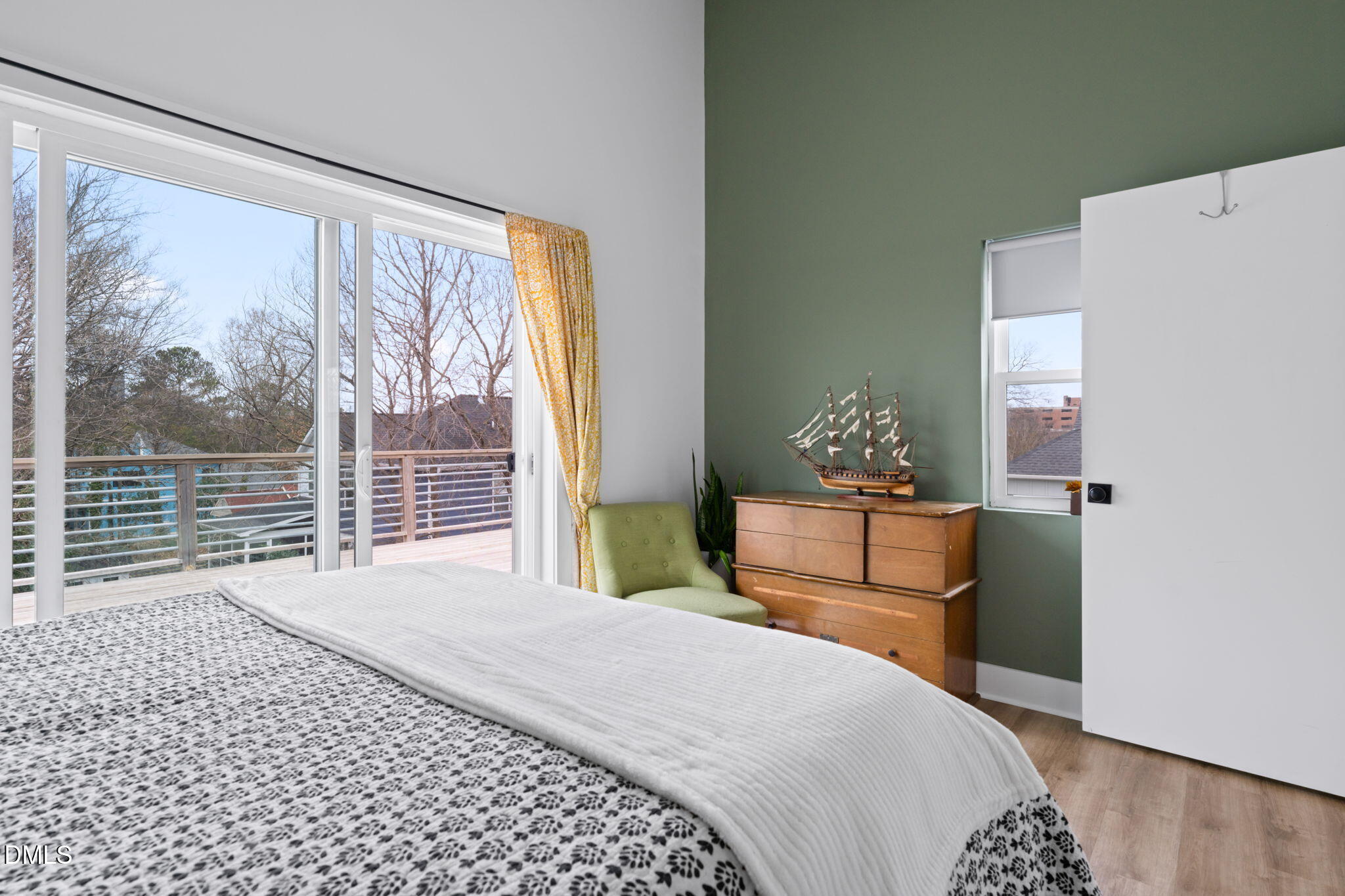 320 South Tarboro Street Raleigh, NC 27610 - Photo 25 of 54 a bedroom with a large bed and a window