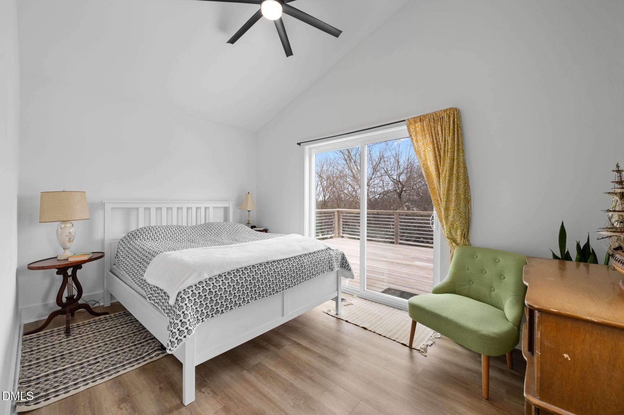 320 South Tarboro Street Raleigh, NC 27610 - Photo 26 of 54 a bedroom with a bed and a chair