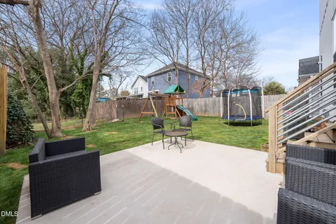 a view of a dinning table and chairs in the roof deck