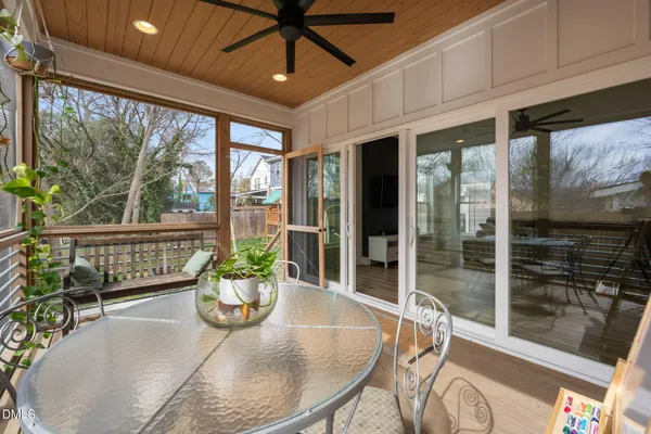 a view of staircase with wooden floor and a window