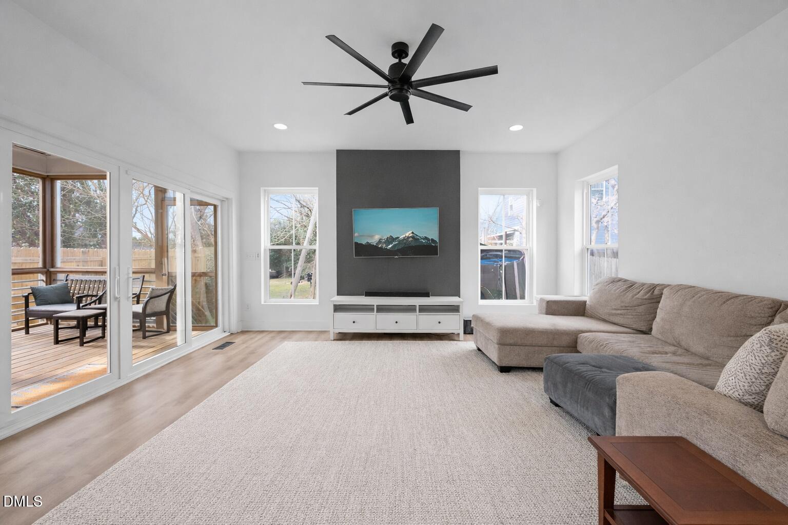 320 South Tarboro Street Raleigh, NC 27610 - Photo 5 of 54 a living room with furniture and large windows