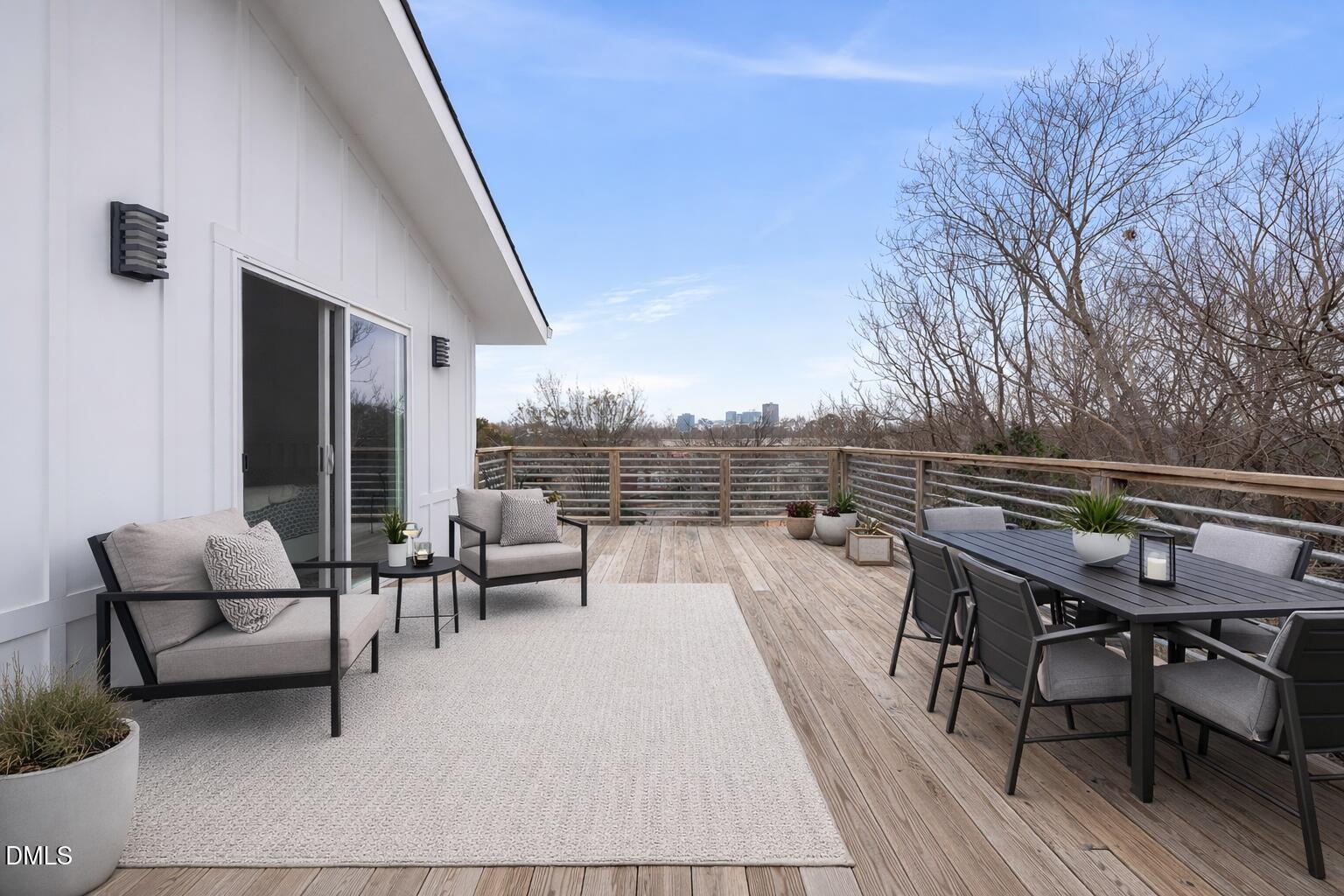 320 South Tarboro Street Raleigh, NC 27610 - Photo 7 of 54 a roof deck with couches and wooden floor