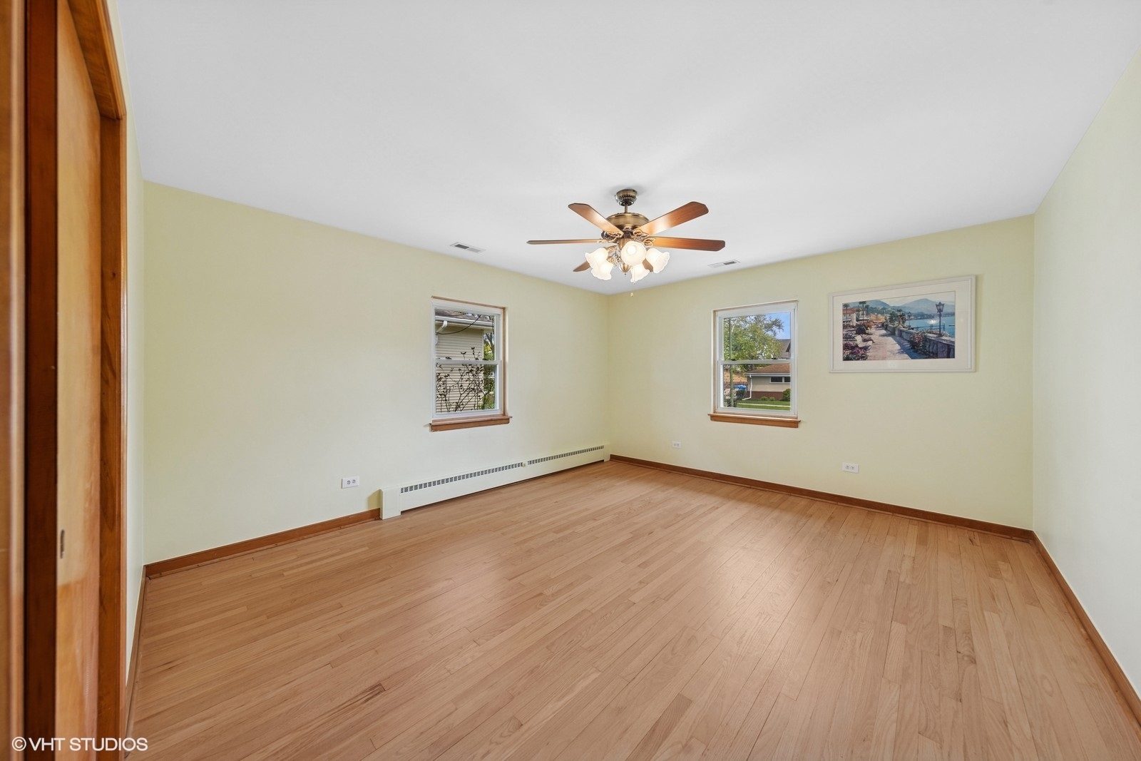7010 West Devon Avenue Chicago, IL 60631 - Photo 11 of 51 a view of an empty room with wooden floor