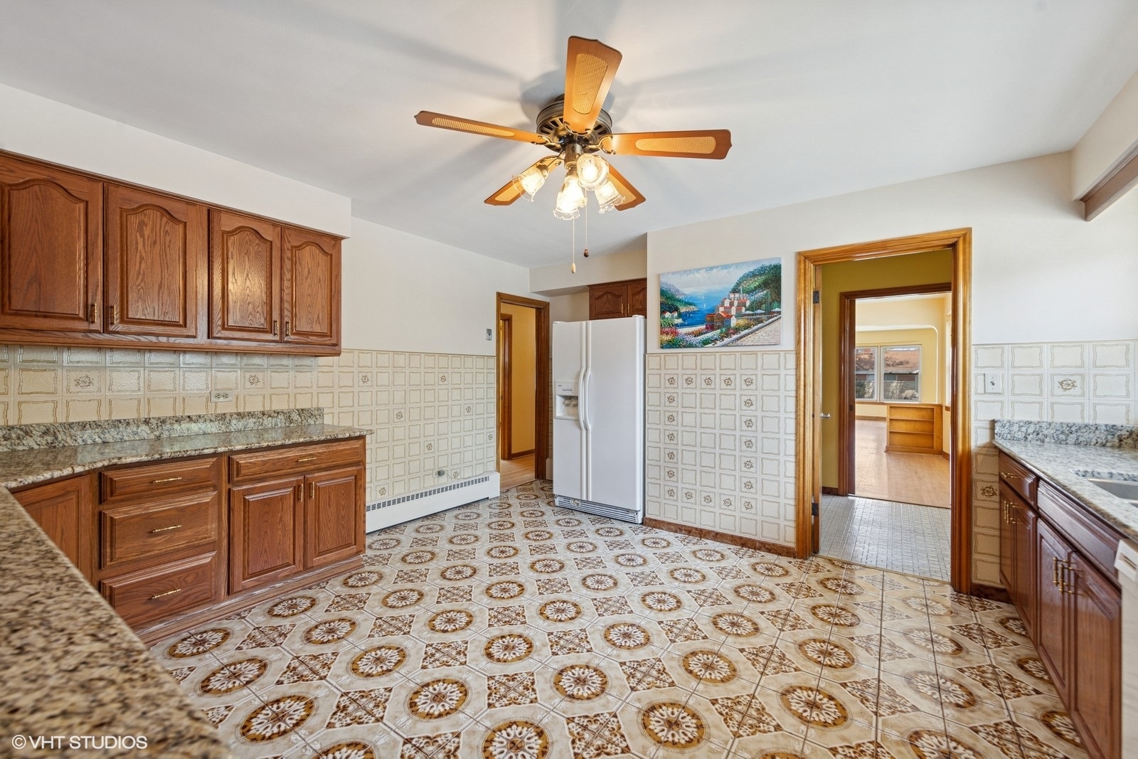 7010 West Devon Avenue Chicago, IL 60631 - Photo 24 of 51 a kitchen with stainless steel appliances granite countertop a refrigerator a stove oven and sink