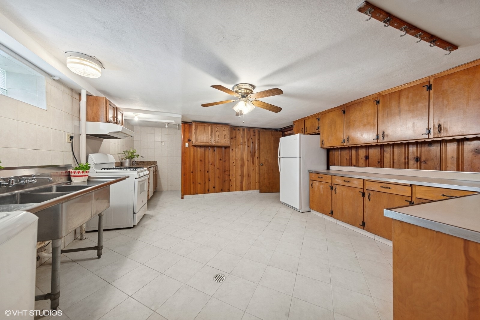 7010 West Devon Avenue Chicago, IL 60631 - Photo 29 of 51 a kitchen with refrigerator and cabinets