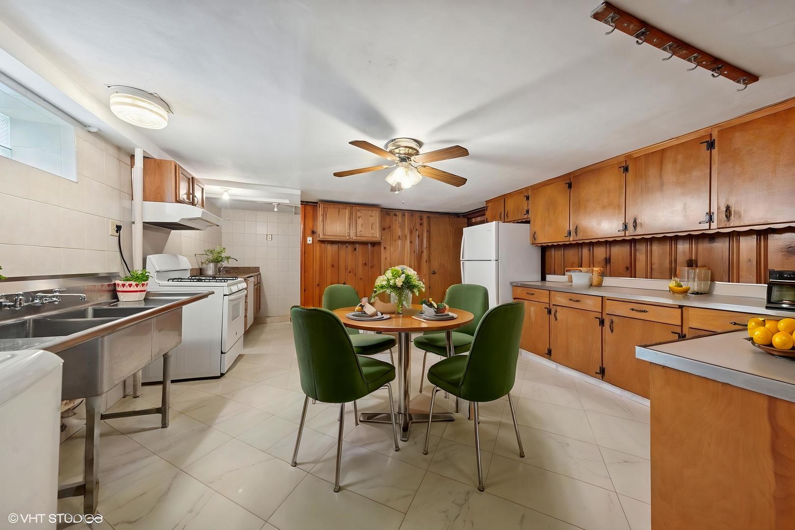7010 West Devon Avenue Chicago, IL 60631 - Photo 30 of 51 a kitchen with stainless steel appliances granite countertop a sink a stove and a refrigerator