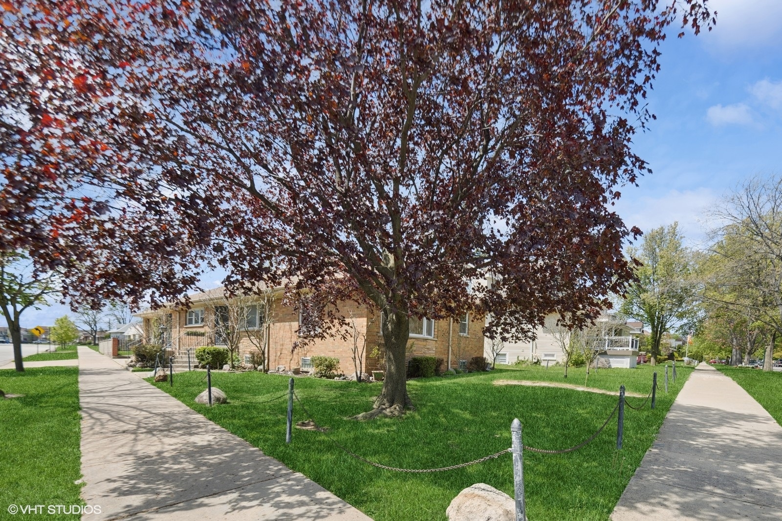 7010 West Devon Avenue Chicago, IL 60631 - Photo 50 of 51 a garden with trees in front of it