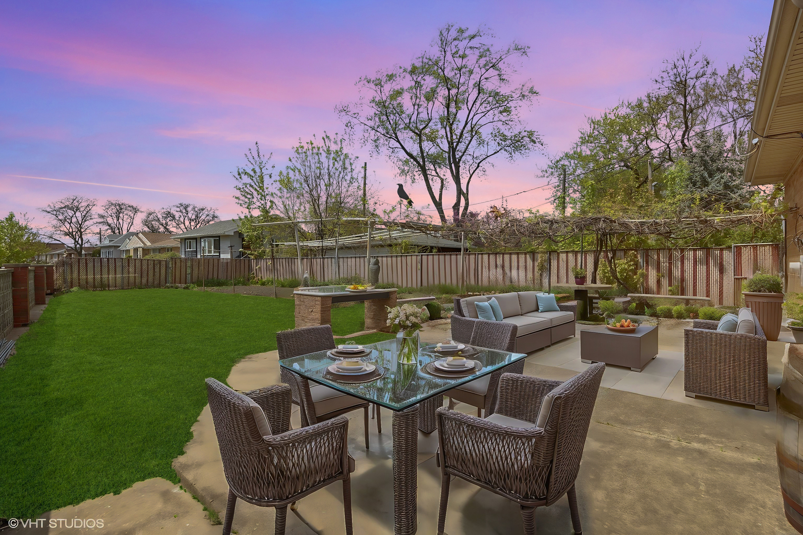 7010 West Devon Avenue Chicago, IL 60631 - Photo 51 of 51 a view of a patio with couches table and chairs and garden