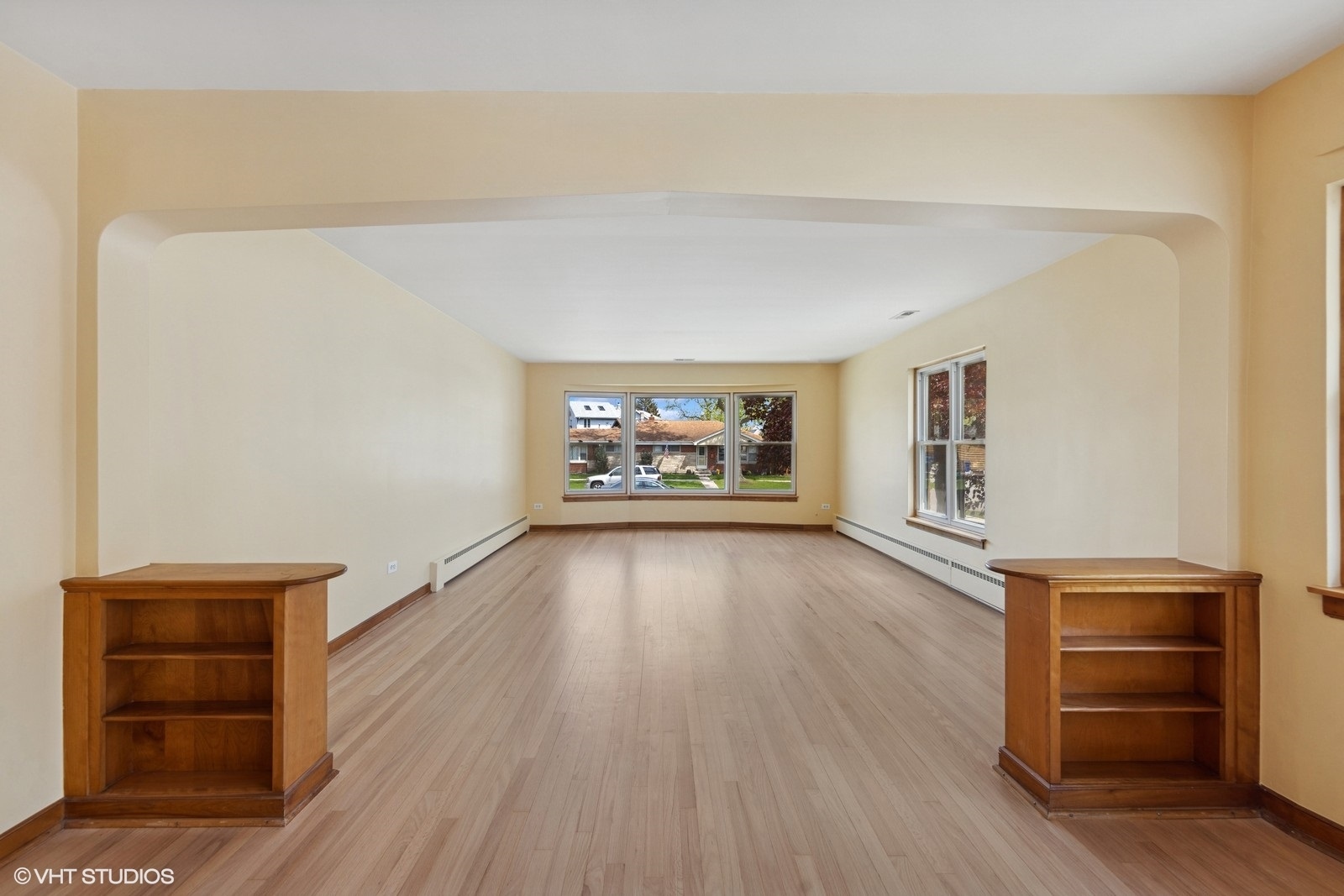 7010 West Devon Avenue Chicago, IL 60631 - Photo 6 of 51 wooden floor in an empty room with a window