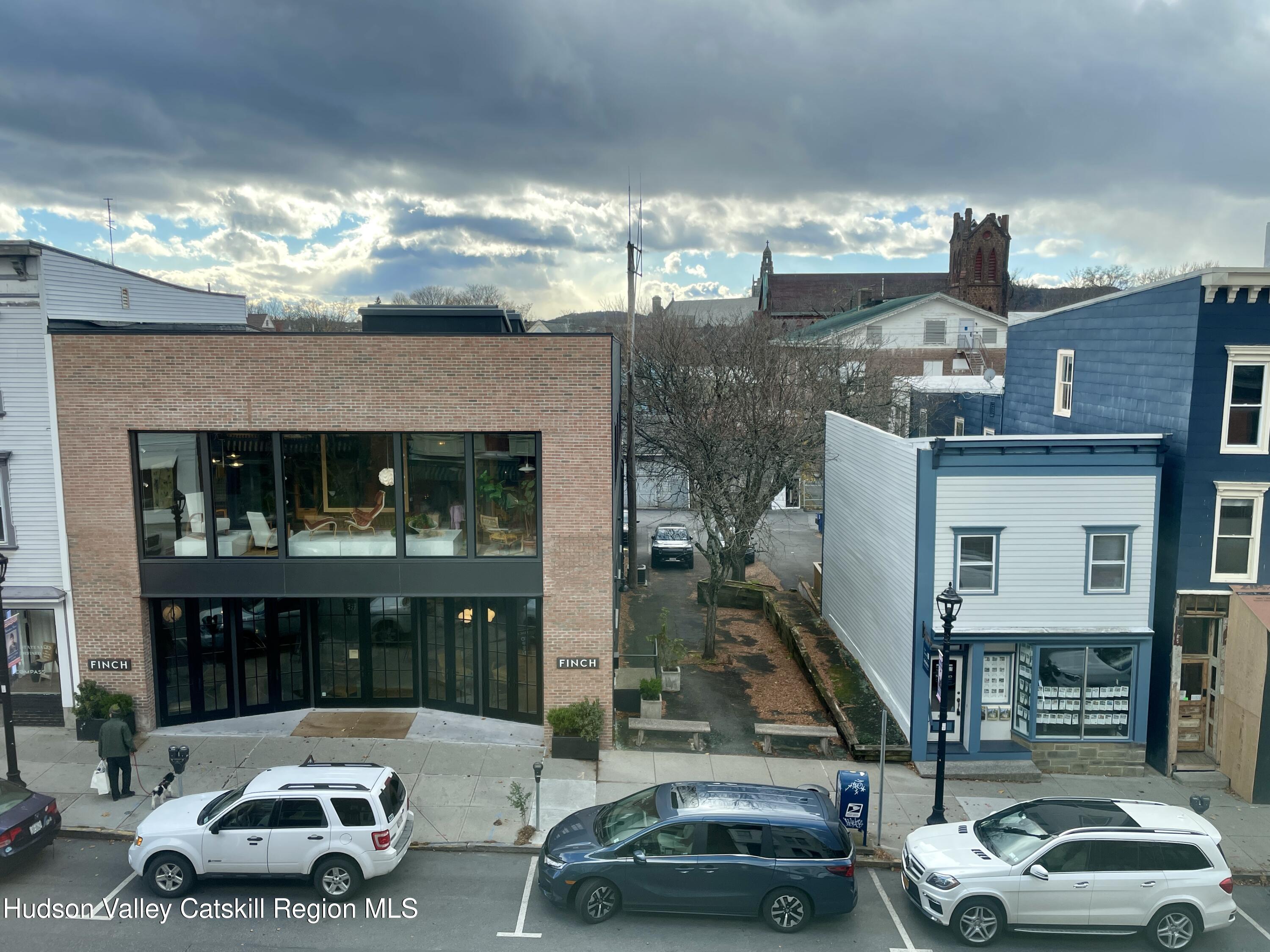 426 Warren Street, Unit 3 Hudson, NY 12534 - Photo 13 of 13 a car parked in front of a building