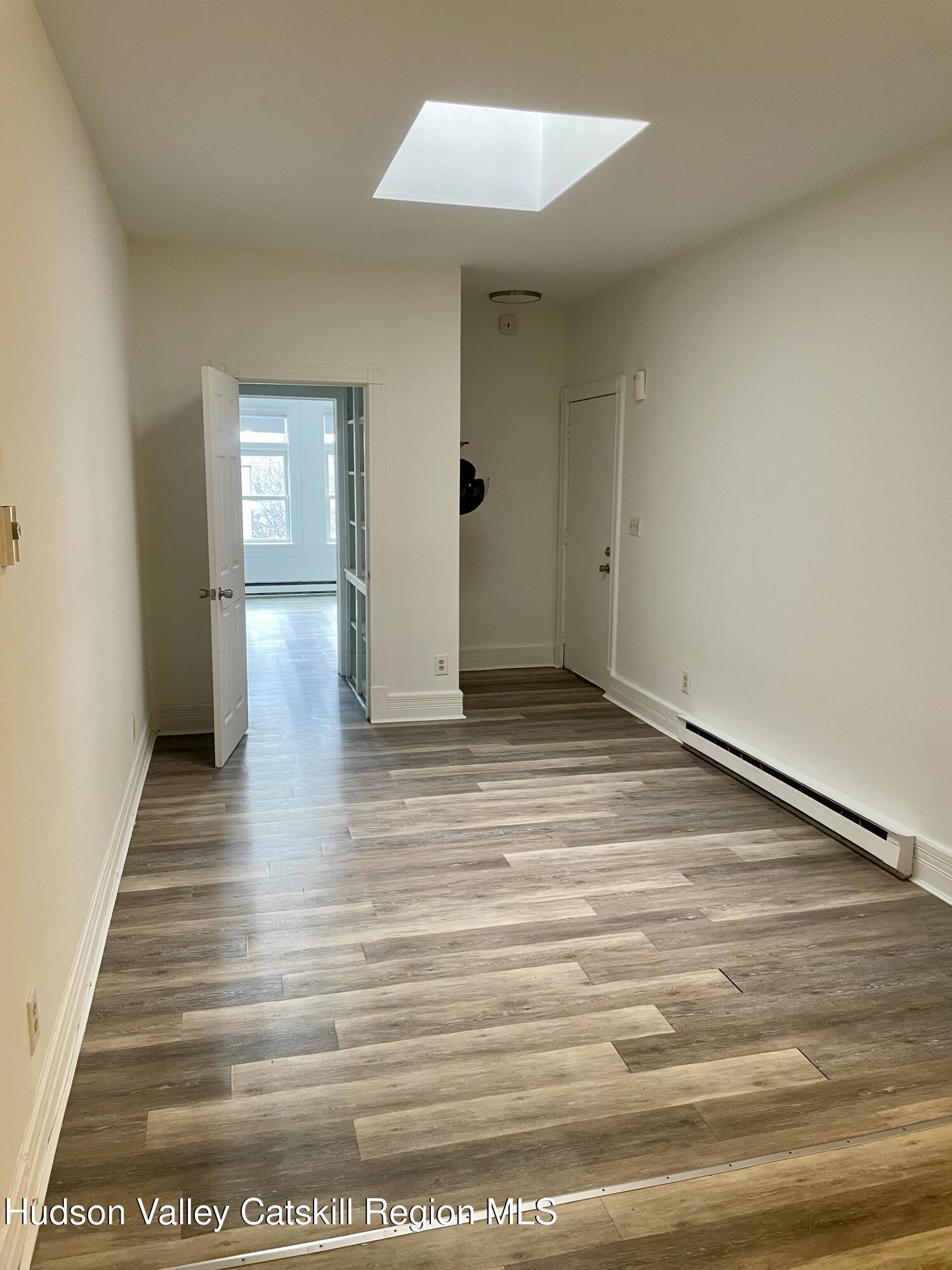 426 Warren Street, Unit 3 Hudson, NY 12534 - Photo 3 of 13 a view of a room with wooden floor