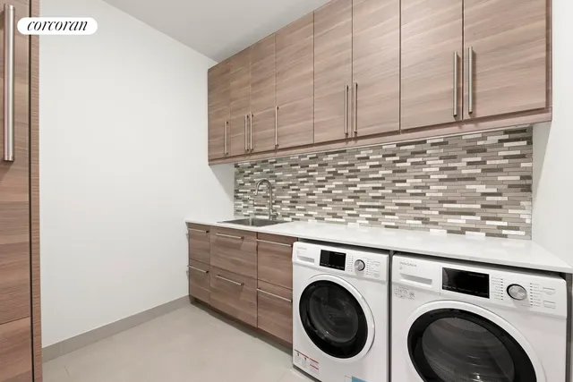 a utility room with dryer and washer