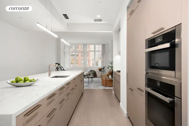 a bathroom with a sink a faucet and a bathtub