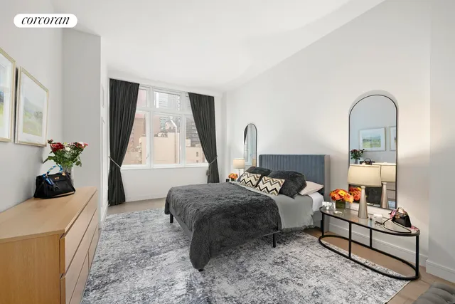 a bedroom with bed and window