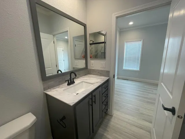a bathroom with a sink and a mirror