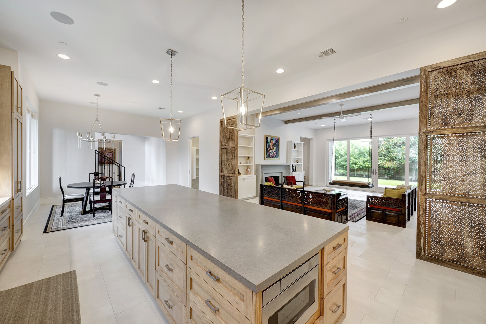 247 Piney Point Road Piney Point Village, TX 77024 - Photo 12 of 40 a kitchen with stainless steel appliances a stove a sink a refrigerator a couch and a larger window