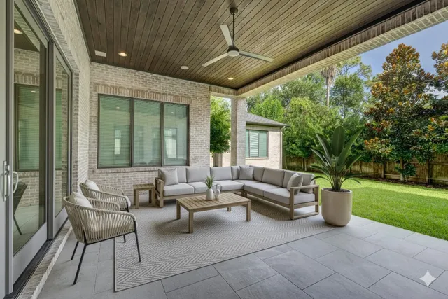 a living room with furniture and a garden
