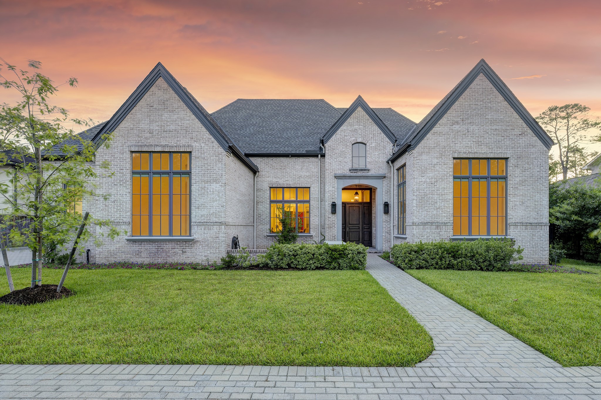 247 Piney Point Road Piney Point Village, TX 77024 - Photo 39 of 40 a front view of yellow house with a yard