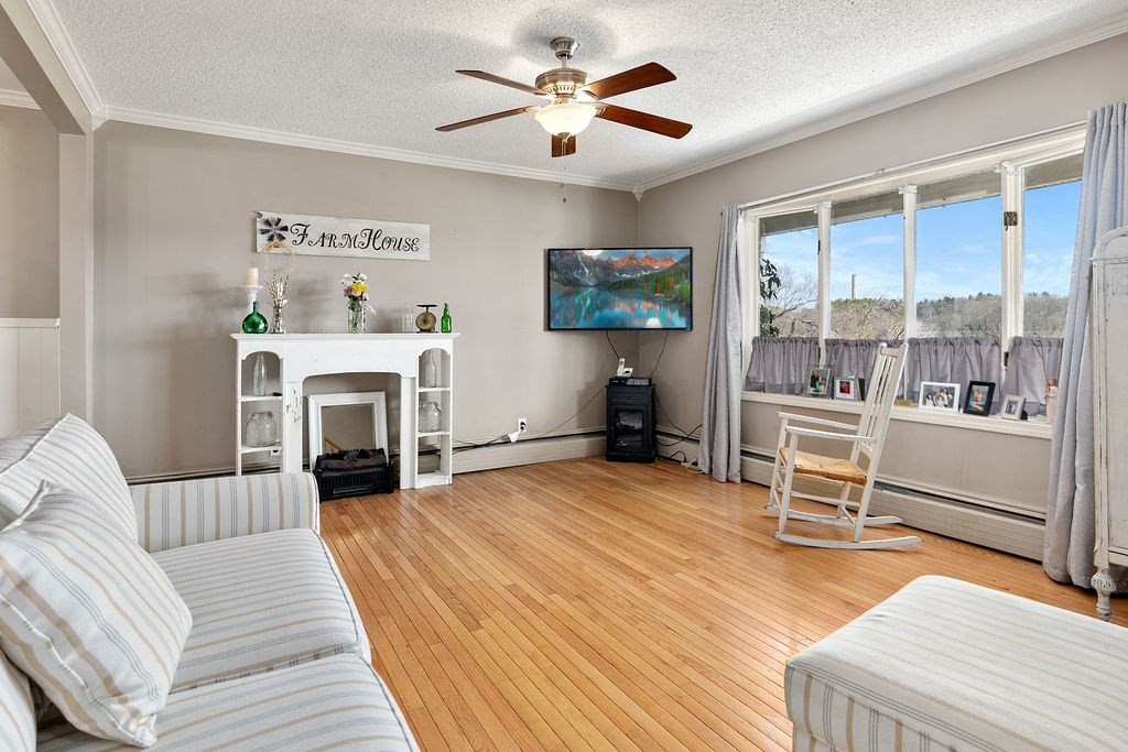 524 Merrimack Street Methuen, MA 01844 - Photo 11 of 34 a living room with furniture and a fireplace