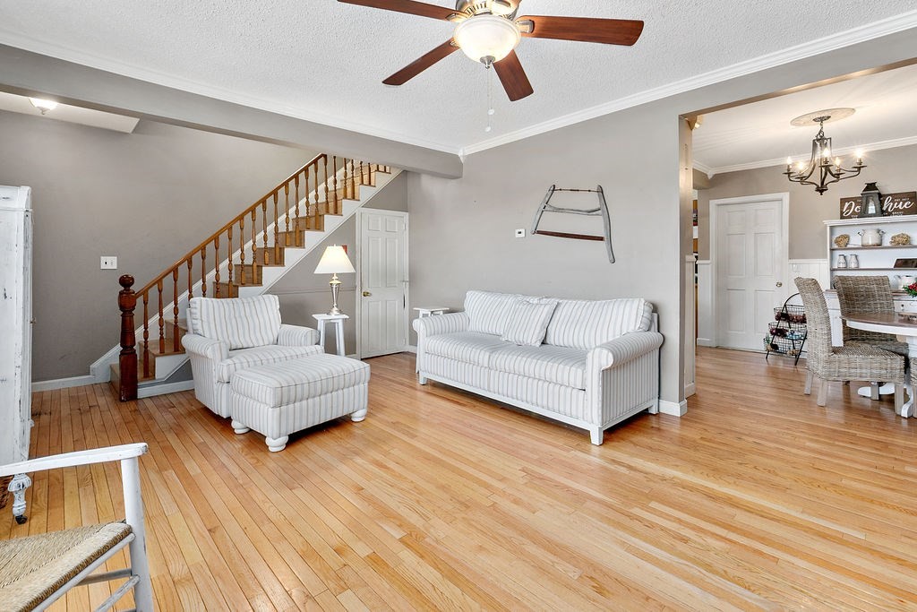 524 Merrimack Street Methuen, MA 01844 - Photo 12 of 34 a living room with furniture and a wooden floor