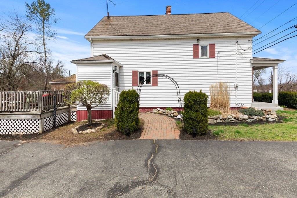 524 Merrimack Street Methuen, MA 01844 - Photo 31 of 34 a front view of a house with garden
