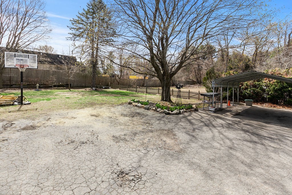 524 Merrimack Street Methuen, MA 01844 - Photo 32 of 34 a view of outdoor space with deck and trees