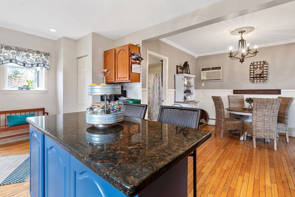 524 Merrimack Street Methuen, MA 01844 - Photo 6 of 34 a view of kitchen island dining room wooden floor and living room
