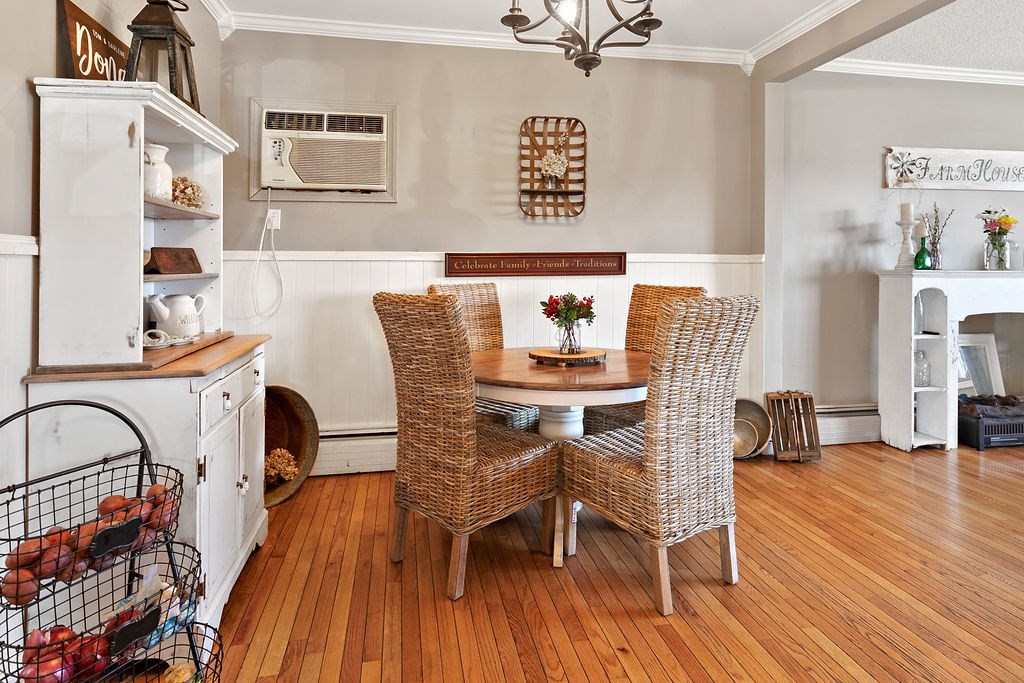 524 Merrimack Street Methuen, MA 01844 - Photo 8 of 34 a dining room with furniture and wooden floor