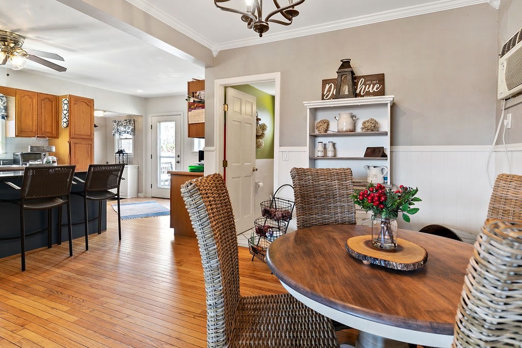 524 Merrimack Street Methuen, MA 01844 - Photo 9 of 34 a living room with furniture dining table and a potted plant