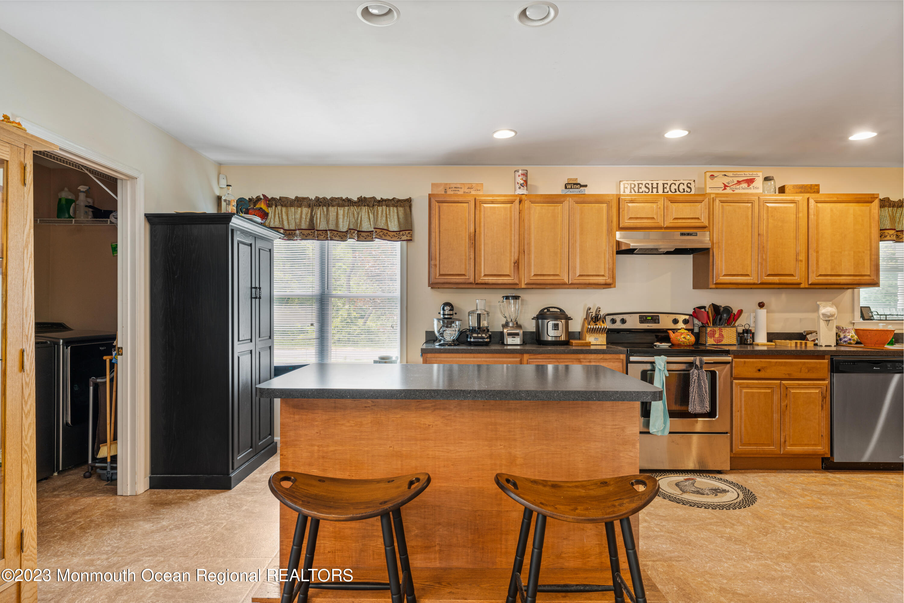 137 Ramah Road Bridgeton, NJ 08302 - Photo 3 of 11 a kitchen with stainless steel appliances granite countertop a stove a sink a refrigerator white cabinets and a refrigerator