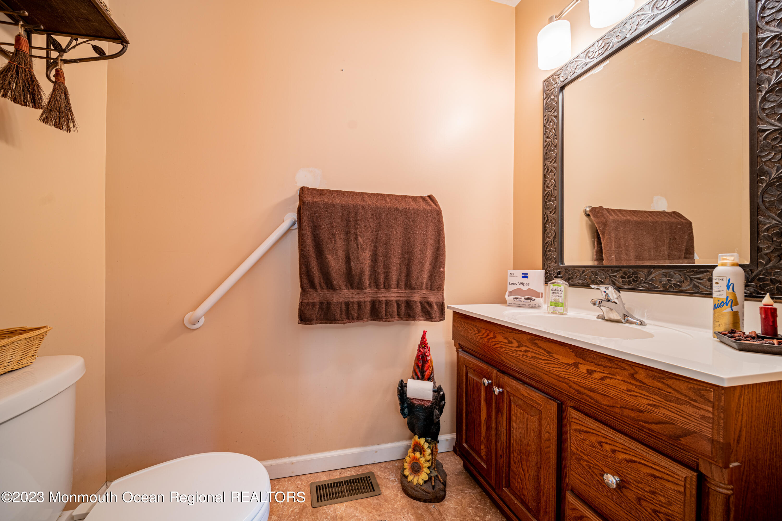 137 Ramah Road Bridgeton, NJ 08302 - Photo 8 of 11 a bathroom with a sink a toilet and mirror