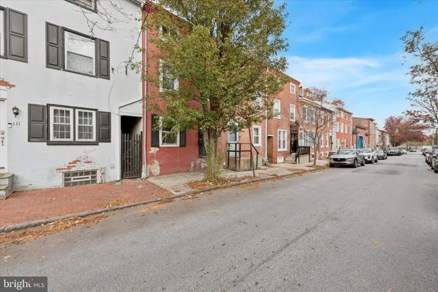 a view of a street with a building in the background
