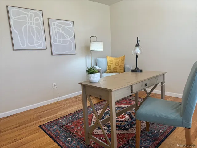 a view of a workspace with furniture