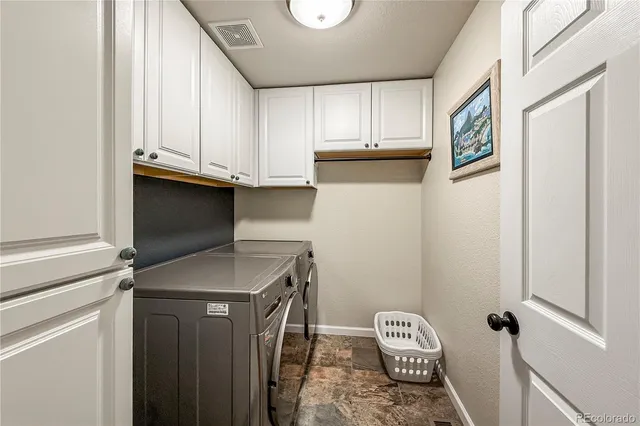 a bathroom with a double vanity sink toilet mirror and shower