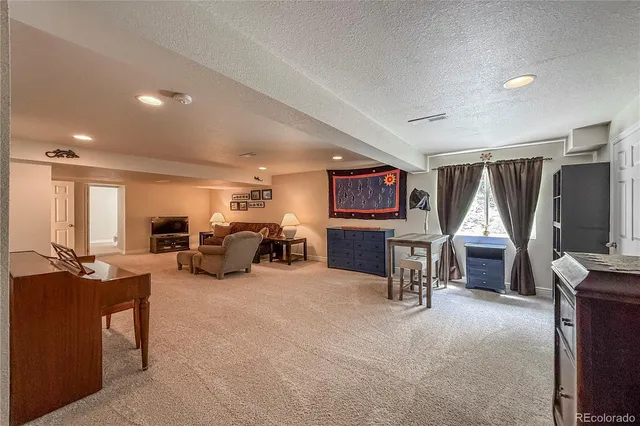 an empty room with furniture and window