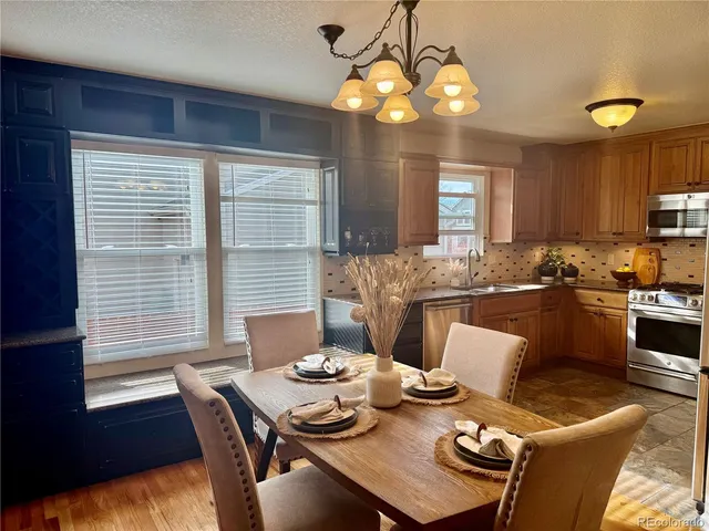 a view of a dining room with furniture window and outside view