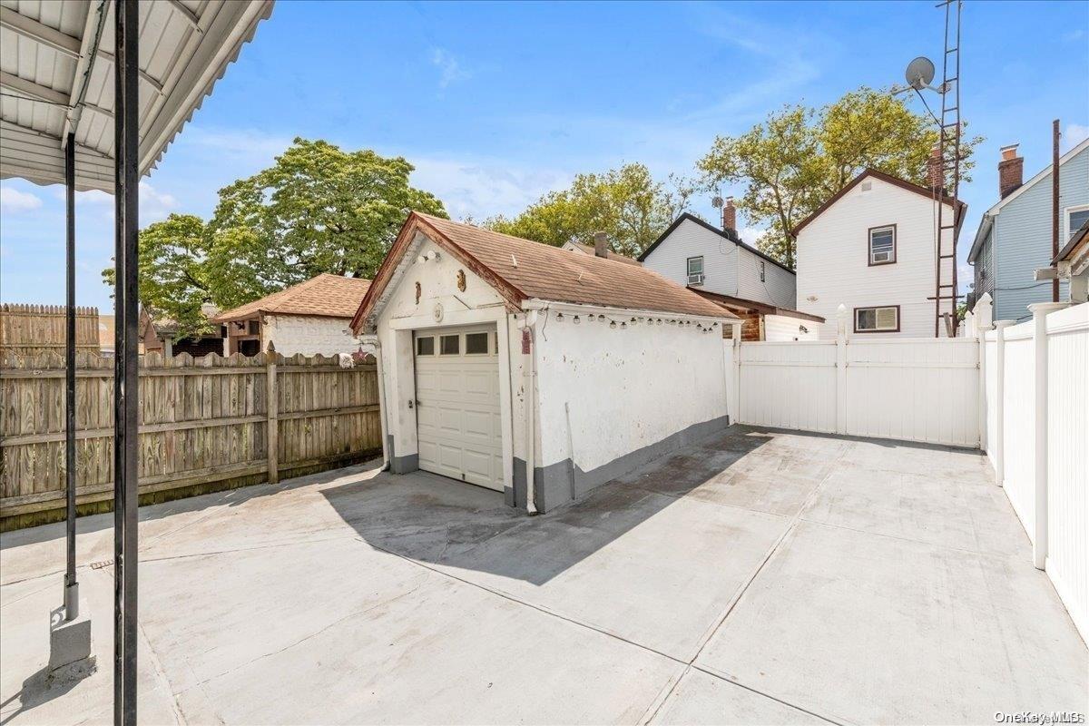 91-26 79th Street Queens, NY 11421 - Photo 14 of 20 a view of a backyard