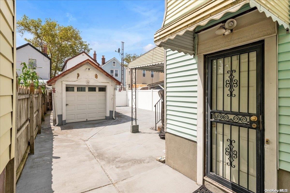 91-26 79th Street Queens, NY 11421 - Photo 16 of 20 a view of a house with a outdoor space
