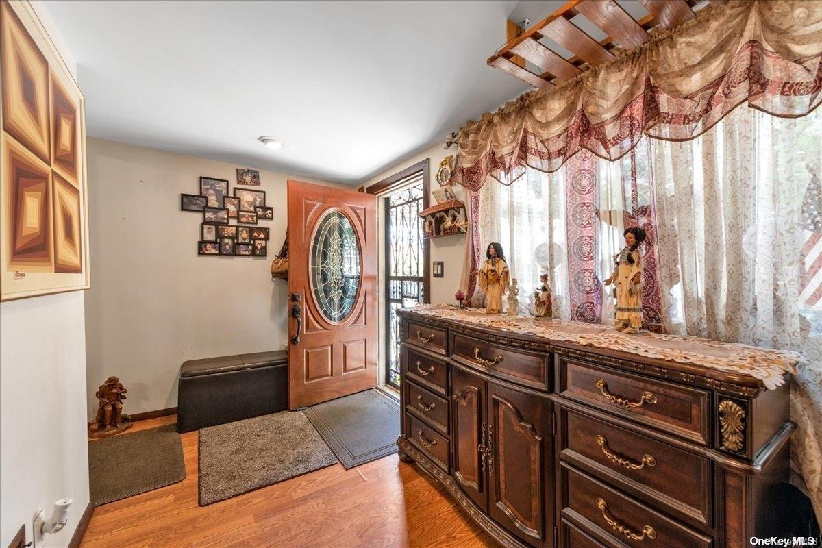 91-26 79th Street Queens, NY 11421 - Photo 2 of 20 a living room with stainless steel appliances granite countertop furniture and a window