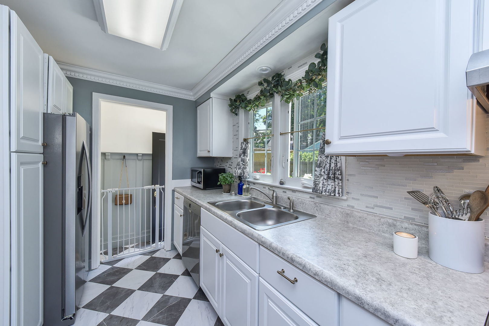 808 Anderson Boulevard Geneva, IL 60134 - Photo 11 of 30 a kitchen with a sink a refrigerator and cabinets