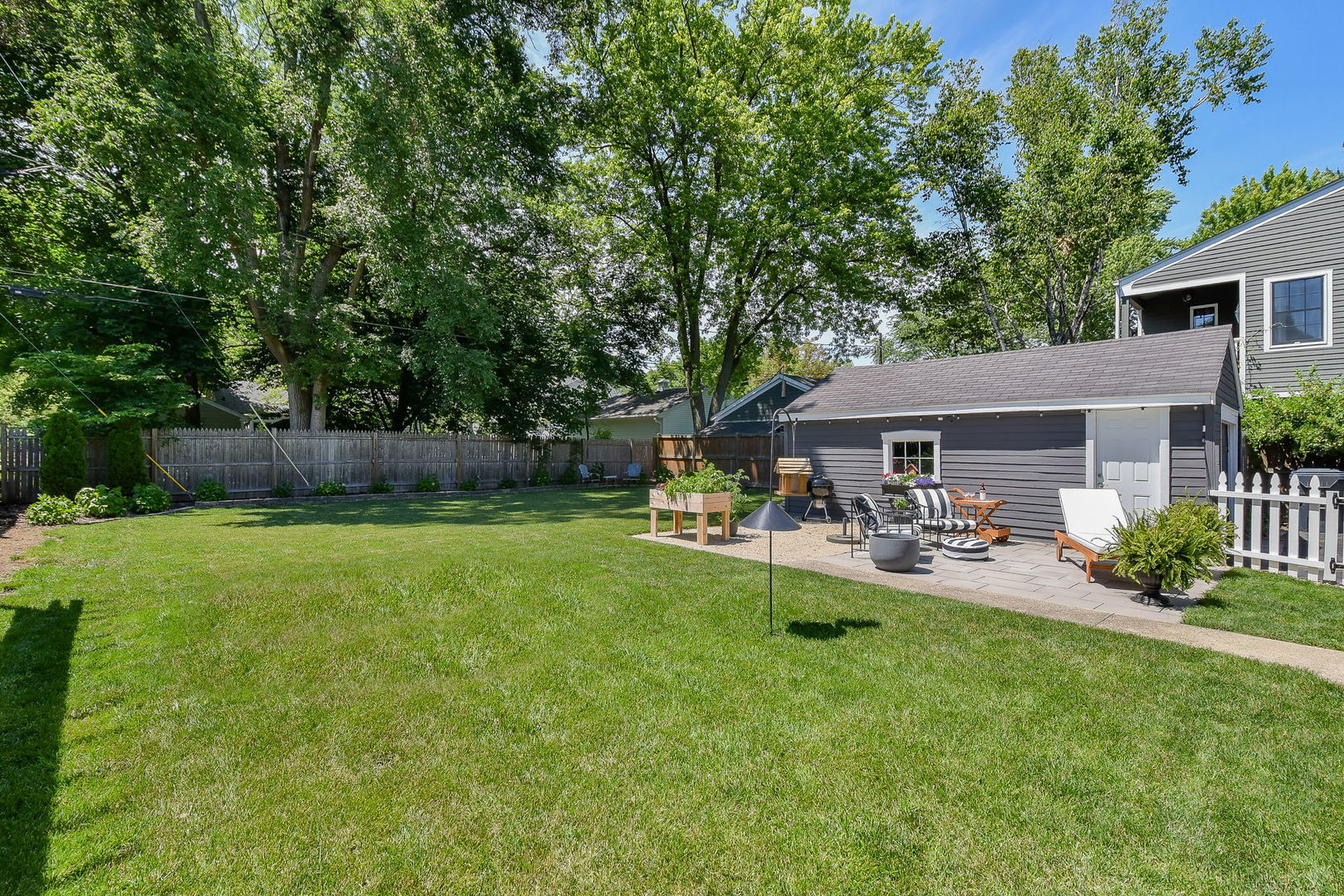 808 Anderson Boulevard Geneva, IL 60134 - Photo 25 of 30 a front view of a house with garden and patio